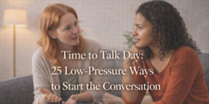 Two women sit on a sofa having a thoughtful conversation. One gestures as she speaks, whilst the other listens attentively. Overlaid text reads: Time to Talk Day: 25 Low-Pressure Ways to Start the Conversation.