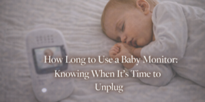 A sleeping baby lies on a bed next to a baby monitor. Overlaid text reads, How Long to Use a Baby Monitor: Knowing When It’s Time to Unplug.
