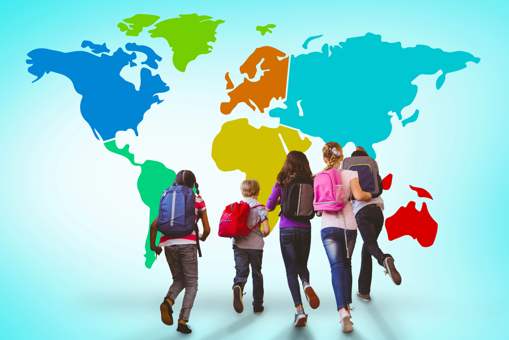 Five children with rucksacks walk towards a colourful world map on a light blue background, suggesting themes of education, exploration, or global learning.