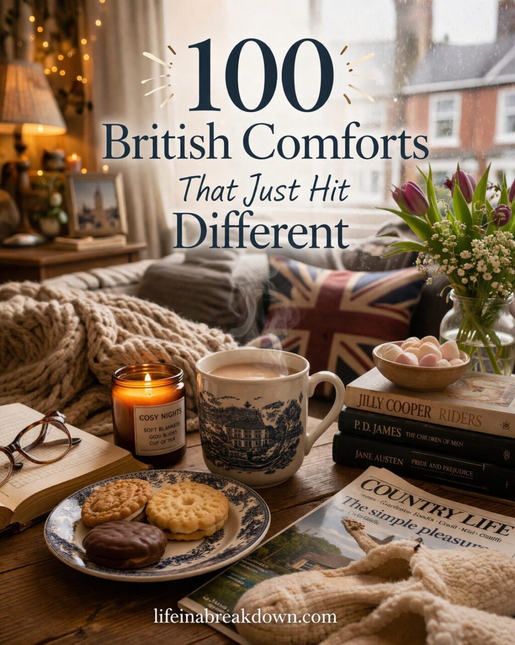A cosy living room scene with tea, assorted biscuits on a blue and white plate, a lit candle, books, glasses, a knitted blanket, and flowers. Text reads, “100 British Comforts That Just Hit Different.”.