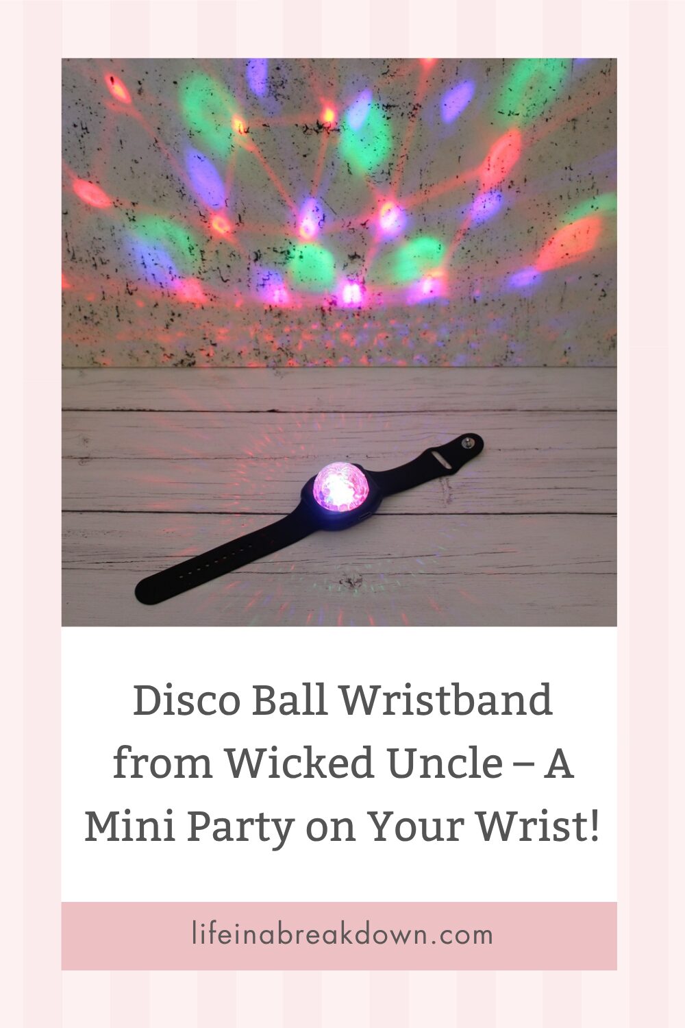 A disco ball wristband emits colourful lights onto a wall and surface, creating a party effect. Text below reads: Disco Ball Wristband from Wicked Uncle – A Mini Party on Your Wrist! lifeinabreakdown.co.uk.