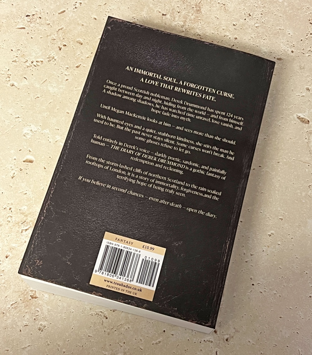 The back cover of a book titled Fantasy priced at £10.99. The cover features a blurb describing the story, barcode, and publisher details against a speckled beige background.
