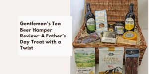 A wicker hamper filled with bottles of beer, biscuits, cheese, and snacks sits open next to a text box reading Gentleman's Tea Beer Hamper Review: A Father's Day Treat with a Twist.