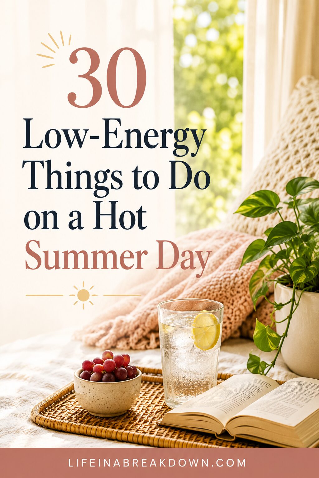 A cosy scene with a glass of water and lemon, a bowl of cherries, an open book, and a potted plant on a bed. Text reads: 30 Low-Energy Things to Do on a Hot Summer Day.