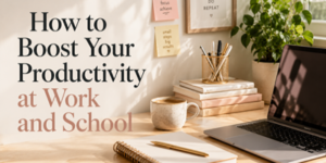 A tidy desk with a laptop, notebooks, a mug, pens, a plant, and motivational sticky notes. Text reads: How to Boost Your Productivity at Work and School. Sunlight streams onto the workspace.