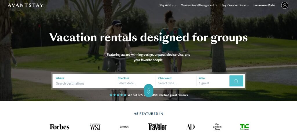 Two people walk bicycles on a sunny path lined with palm trees. A search form for holiday rentals is overlaid with the text: Holiday rentals designed for groups. Logos of featured publications are shown below.