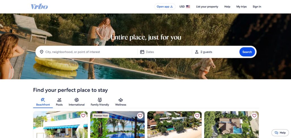 Vrbo homepage showing a search bar over a background image of people by a pool, with options to select location, dates, and number of guests. Below are categories like Beachfront and Pools with property listings.