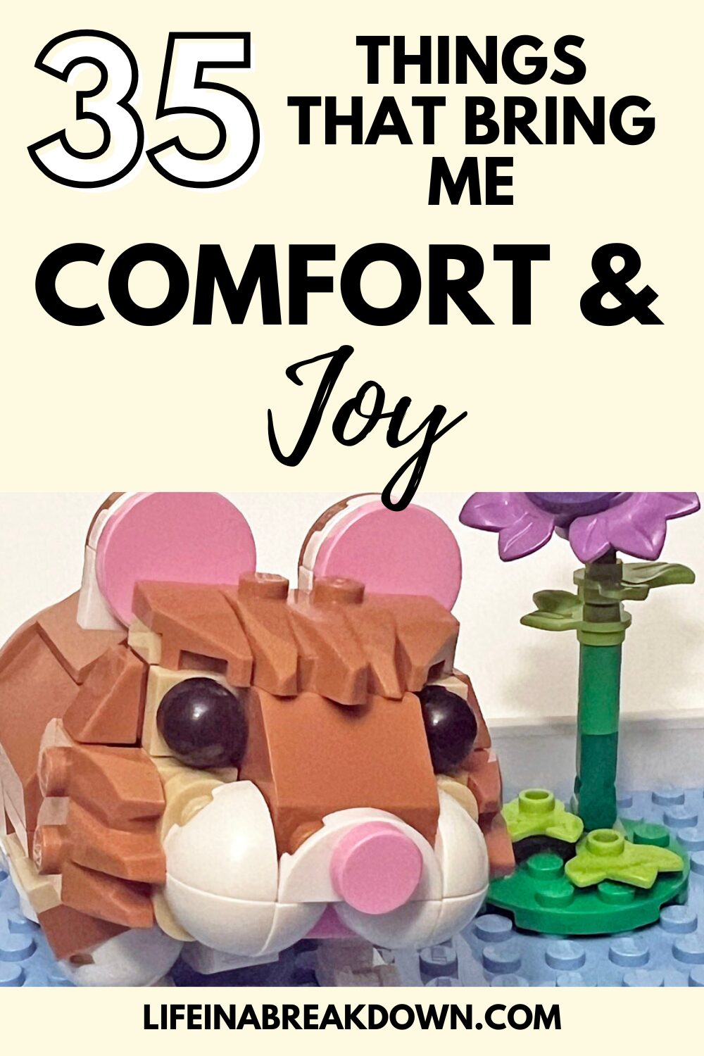 A LEGO hamster figure sits beside a flower, with text above reading, “35 Things That Bring Me Comfort & Joy.” The website “lifeinabreakdown.co.uk” appears at the bottom.