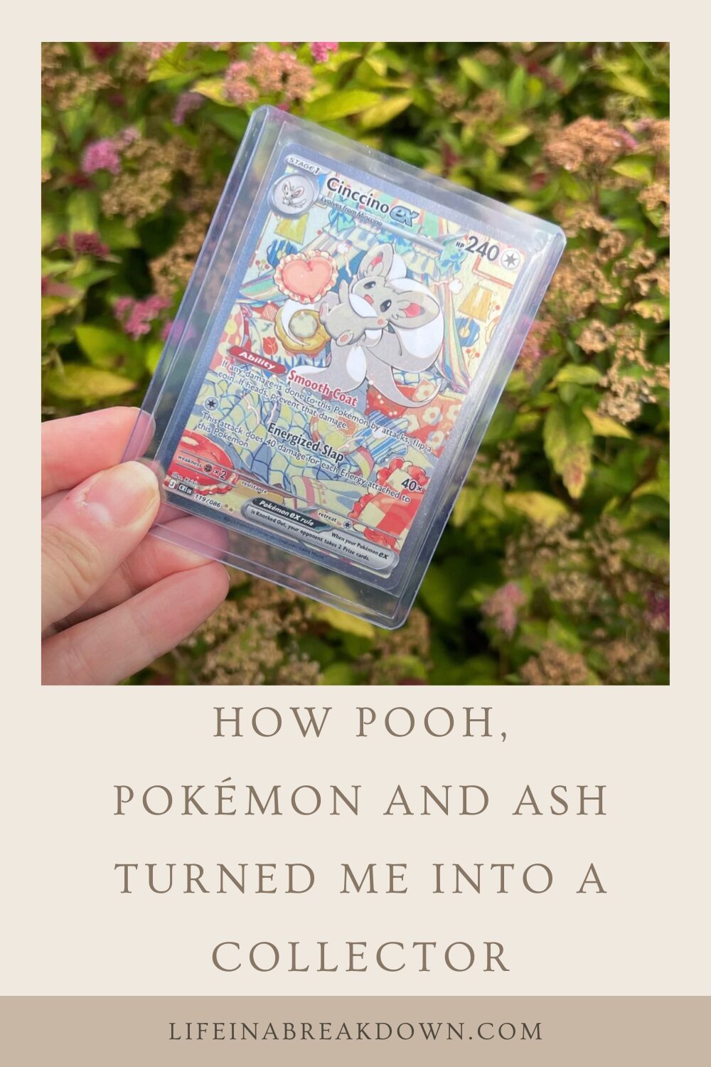 A hand holds a holographic Pokémon card in a plastic sleeve, with flowers and greenery in the blurred background. Text below reads: How Pooh, Pokémon, and Ash turned me into a collector.
