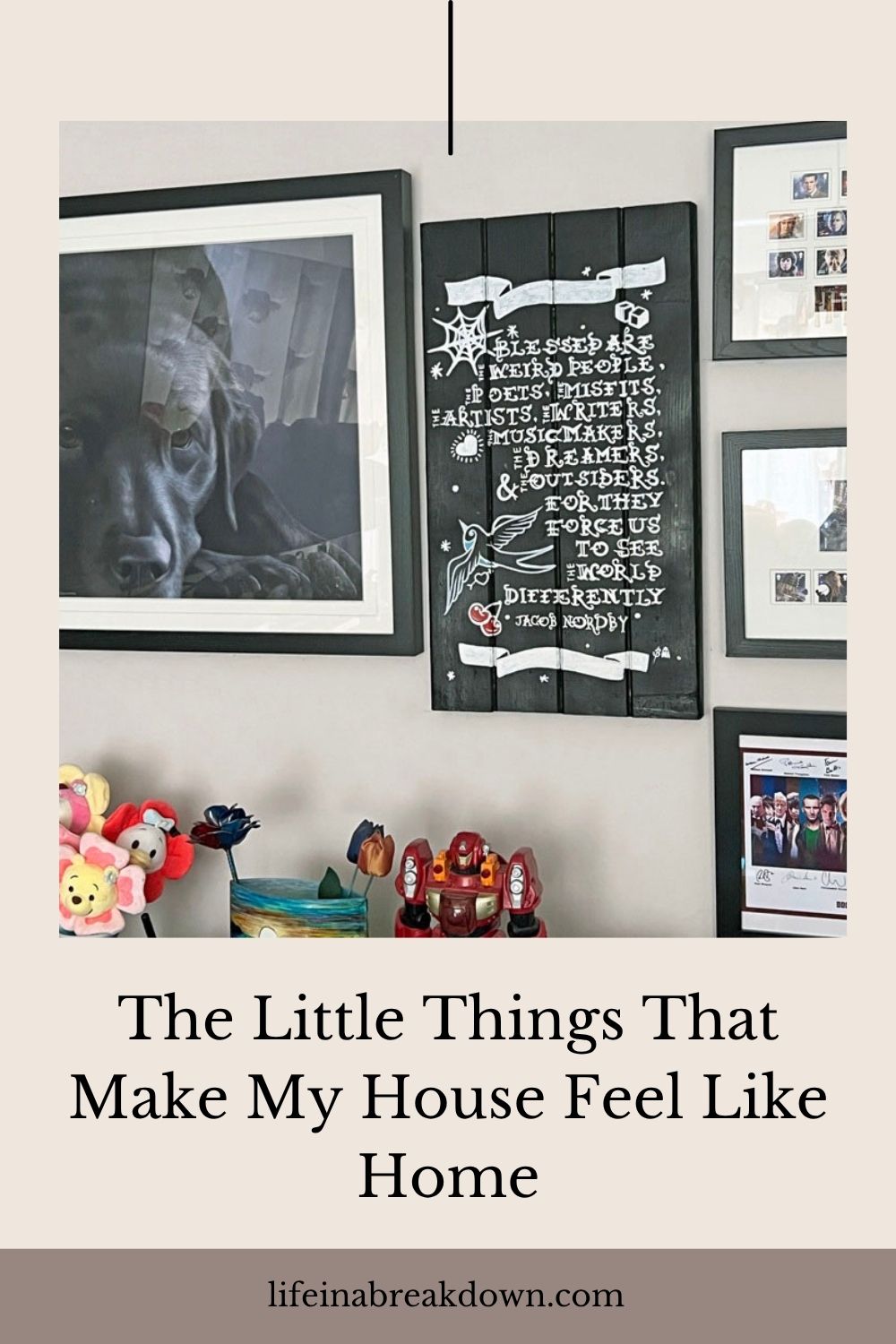 A wall with framed photos, a chalkboard sign with a quotation, and shelves displaying soft toys. Text below reads: The Little Things That Make My House Feel Like Home..