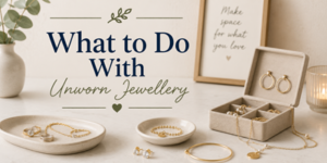 A collection of gold jewellery is displayed on trays and in a box. Text reads: What to Do With Unworn Jewellery. A framed quote and a plant are in the background on a marble surface.