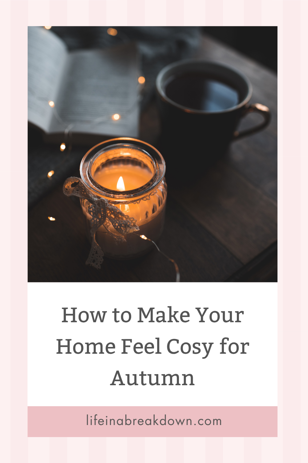 A lit candle, an open book, and a mug sit on a wooden table. Text reads: How to Make Your Home Feel Cosy for Autumn. Website: lifeinabreakdown.com. Warm, cosy atmosphere with soft lights.
