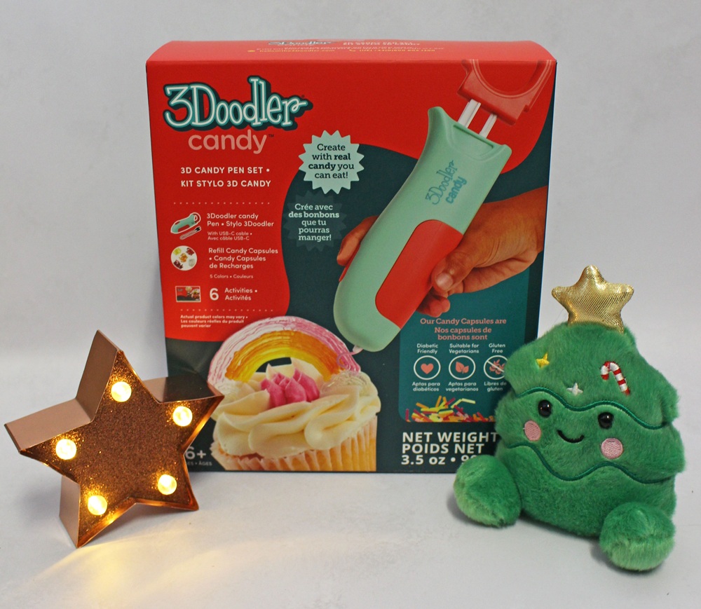 3Doodler candy pen set box, a light-up star-shaped decor, and a plush Christmas tree toy.