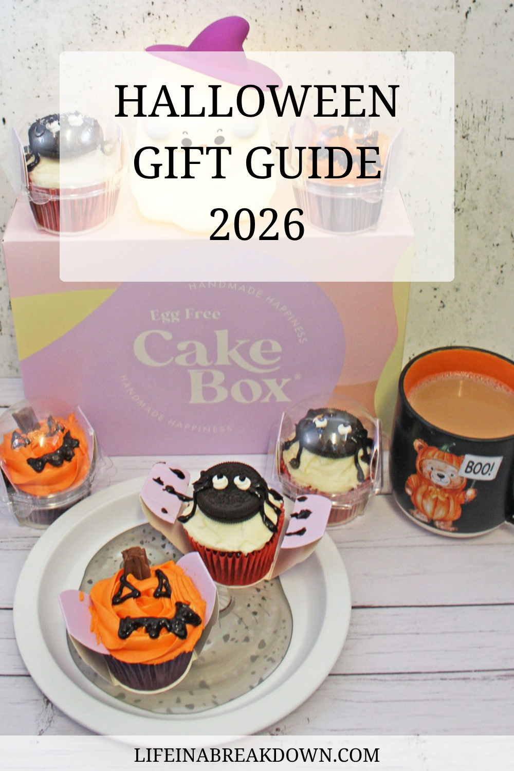 Halloween cupcakes and a mug of coffee in front of a Cake Box gift box with the text Halloween Gift Guide 2026.